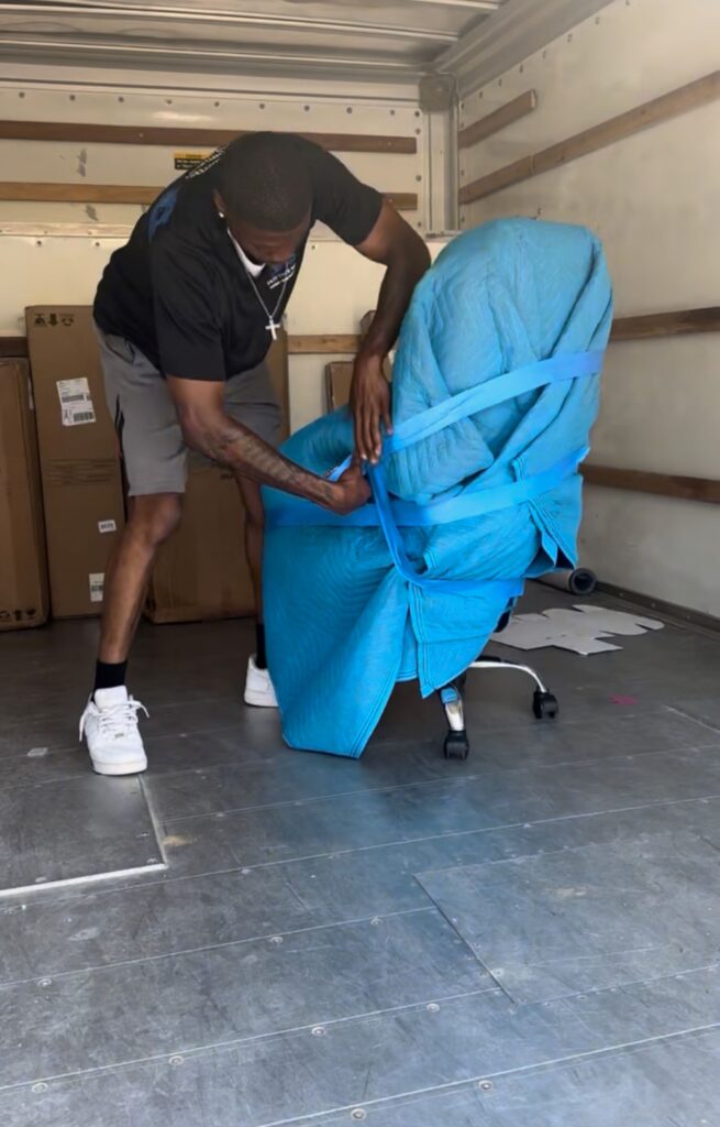 Fast Track Movers wrapping up furniture